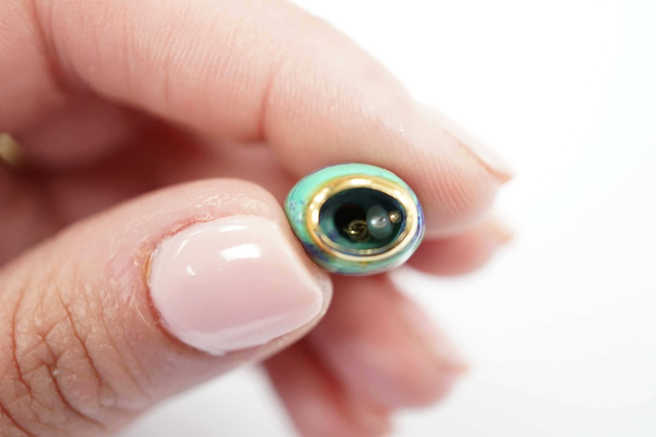 A modern 750 yellow metal, baroque pearl and enamelled charm, 14mm, on a 9ct chain, 56cm, gross weight 7.6 grams.